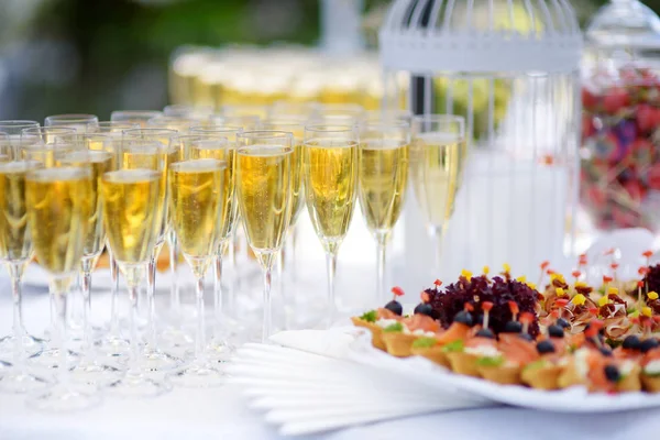 Lots of wine glasses during party — Stock Photo, Image