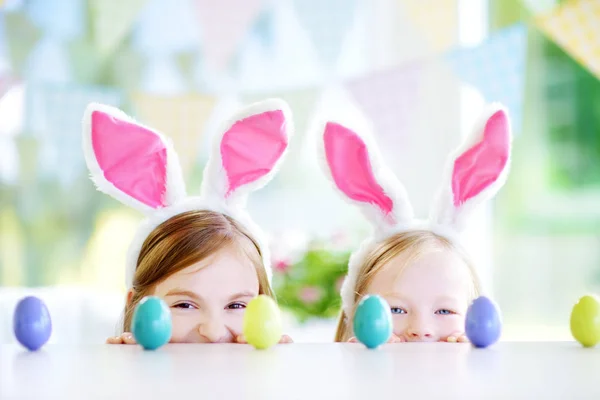 Two cute little sisters wearing bunny ears — Stock Photo, Image