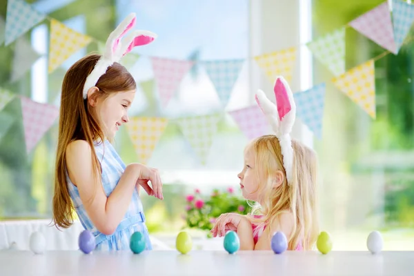 Two cute little sisters wearing bunny ears — Stock Photo, Image