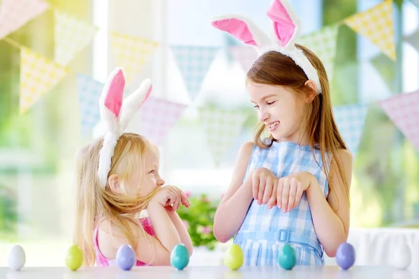 Two cute little sisters wearing bunny ears — Stock Photo, Image