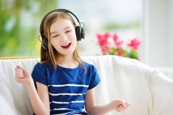 little girl listening to kids songs