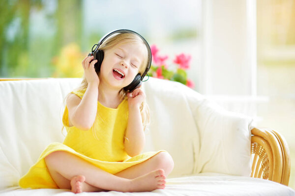 girl wearing huge wireless headphones