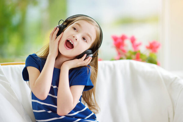 girl wearing huge wireless headphones