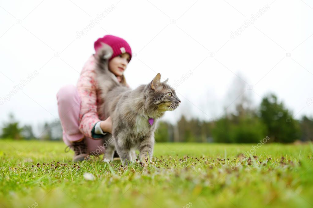Cute little girl with cat 