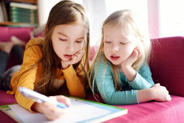 Two little sisters writing letter — Stock Photo, Image