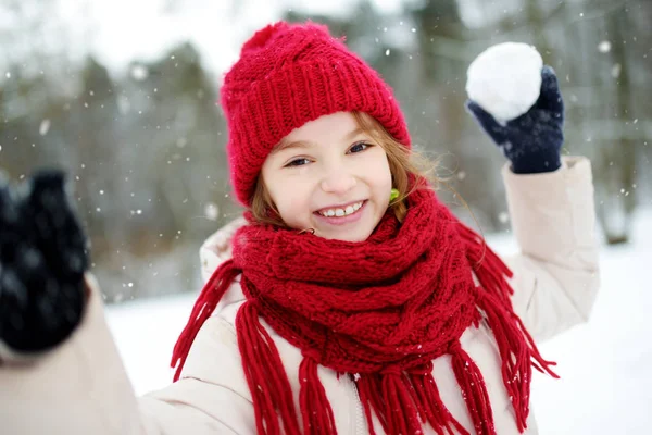 Little girl in winter park Stock Image