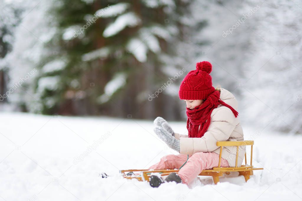 Cute child playing in a snow.