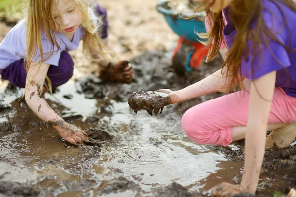 Two Funny Little Girls Playing Large Wet Mud Puddle Sunny — Stock Photo, Image