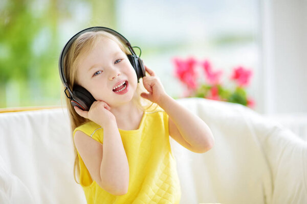 little girl listening to music