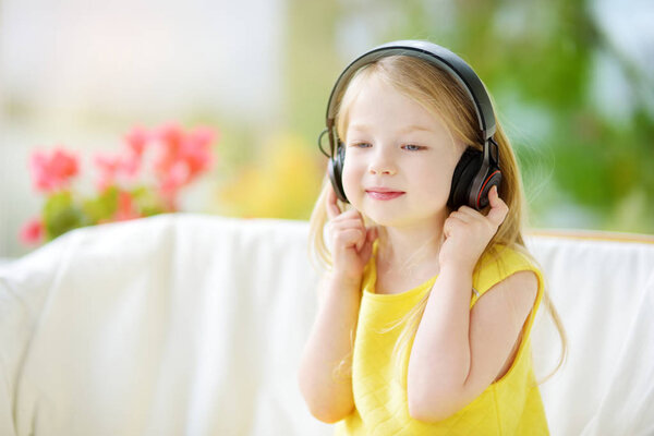 little girl listening to music