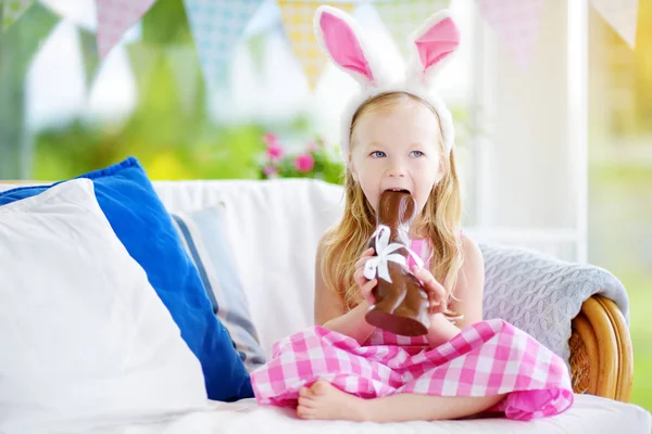 little girl eating Easter rabbit
