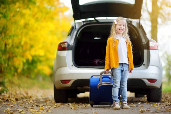 Adorable girl with suitcase — Stock Photo, Image