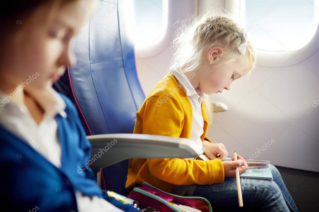 little girls traveling by airplane