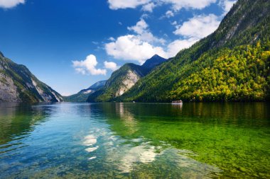 Stunning deep green waters of Konigssee, known as Germany's deepest and cleanest lake, located in the extreme southeast Berchtesgadener Land district of Bavaria, near the Austrian border. clipart