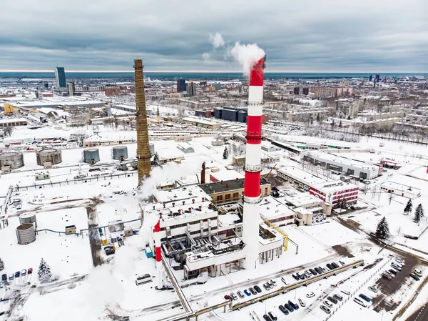 Aerial view of biofuel boiler-house plant facilities with steaming chimneys on chilly winter day in Klaipeda, Lithuania