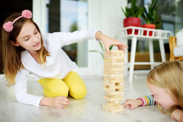 Two Cute Sisters Playing Wood Blocks Tower Game Home Kids — Stock Photo, Image