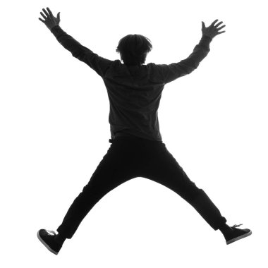 Beyaz izole bir arka plana atlayan koyu renk siluet bir adam. Arkadan görüntü.