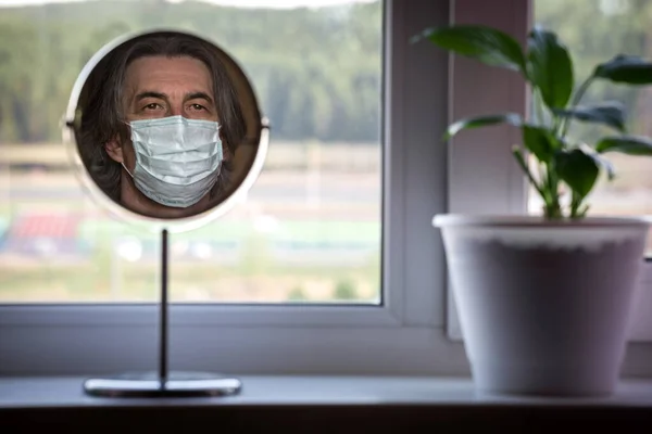 Reflection Portrait Man Medical Mask Mirror Standing Windowsill Apartment Concept — Stock Photo, Image