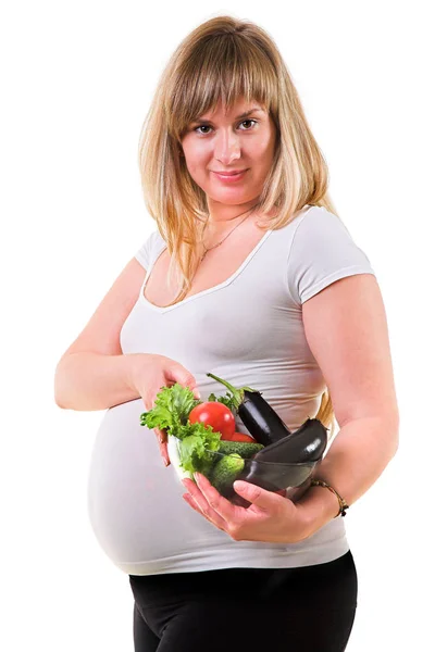 Schwangere blonde Frau isst Salat — Stockfoto