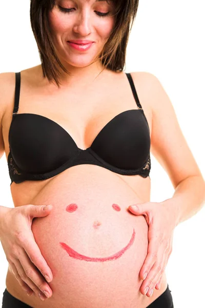 Mulher grávida com quadro emoticon sorridente — Fotografia de Stock