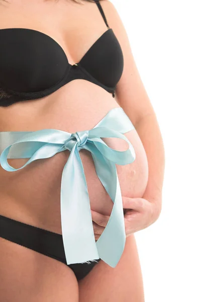 Terhes nő hasa körül szalaggal — Stock Fotó
