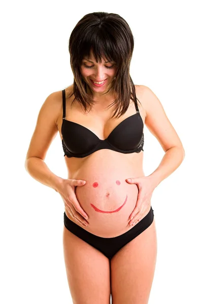 Mujer embarazada con emoticono sonriente pintura —  Fotos de Stock