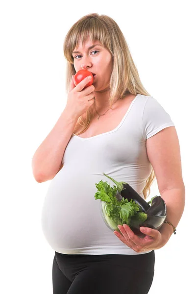 Mujer embarazada comiendo verduras — Foto de Stock