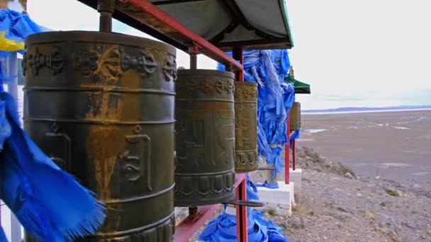 Row Buddhist Prayer Drums Blue Ribbons West Mongolia — Stock Video