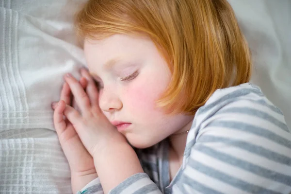 Ruddy Girl Sleeps Her Hands Folded Her Cheek — Stock Photo, Image