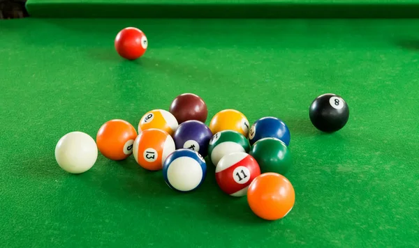 Billiard balls composition on green pool table — Stock Photo, Image