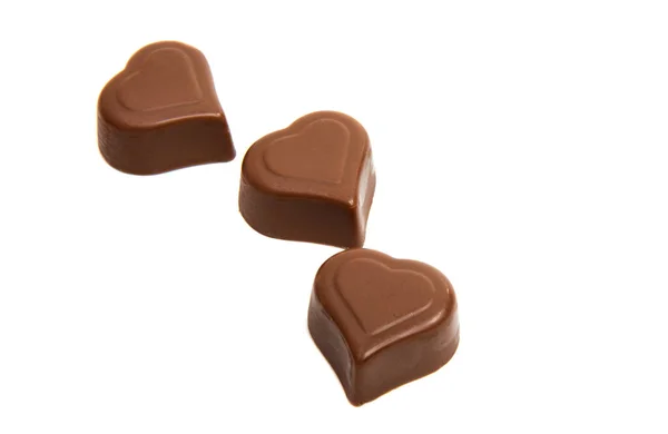 Chocolate caramelo corazones aislados — Foto de Stock