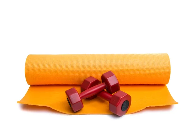 Жёлтый коврик для йоги — стоковое фото