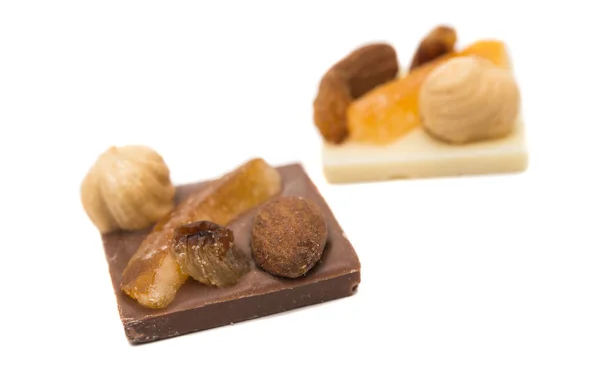 Chocolate with nuts and raisins isolated — Stock Photo, Image