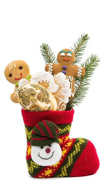 Galletas en un calcetín de Navidad aislado — Foto de Stock