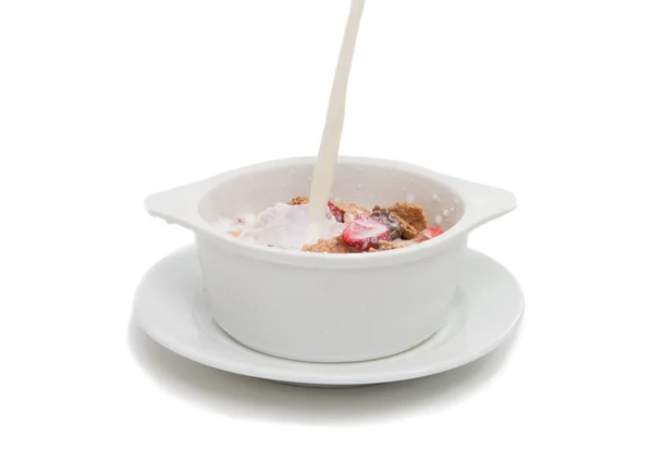 Muesli with chocolate and strawberries in milk — Stock Photo, Image