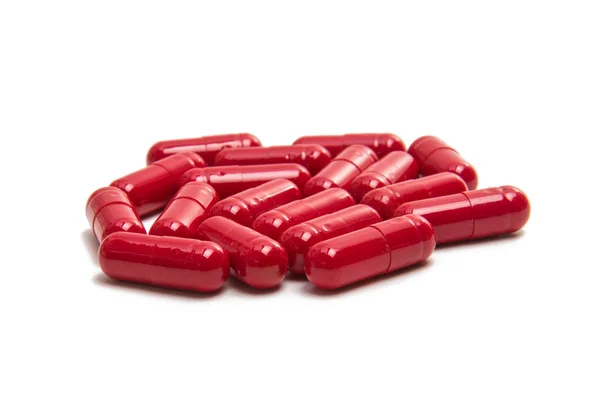 Red capsules isolated — Stock Photo, Image
