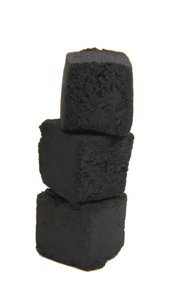 Cubes of coconut coal for a hookah on a white background. — Stock Photo, Image