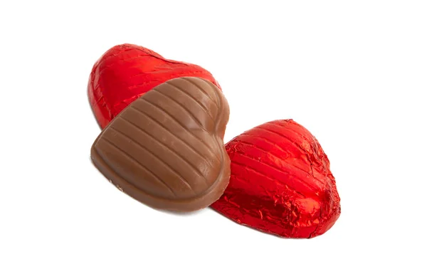 Chocolade harten in folie geïsoleerd — Stockfoto