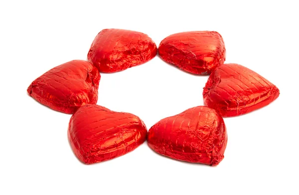 Chocolate hearts in foil isolated Stock Picture