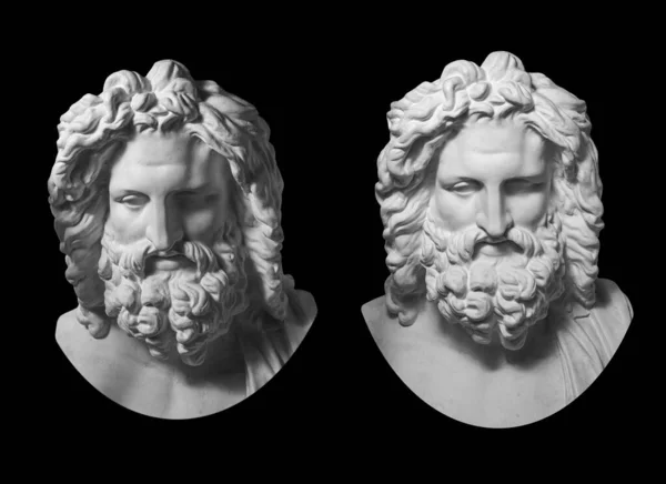 Two gypsum copy of antique statue Zeus head isolated on black background. Plaster sculpture man face with beard. — Stock Photo, Image