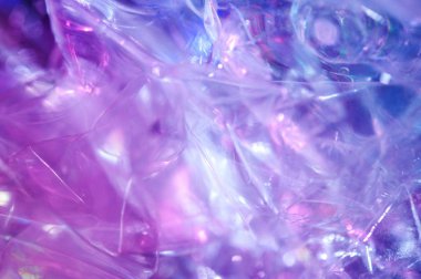 80-90 'ların tarzında holografik arkaplan. Parlak asit renklerinde selofan filmin gerçek dokusu.