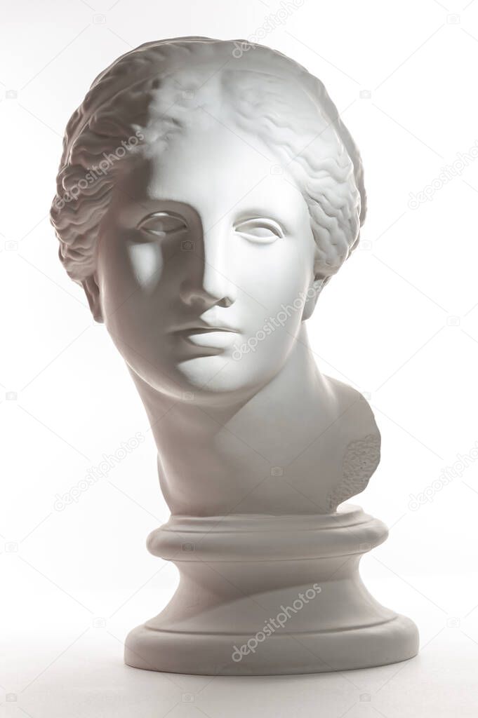 Gypsum copy of ancient statue Venus head isolated on white background. Plaster sculpture woman face.