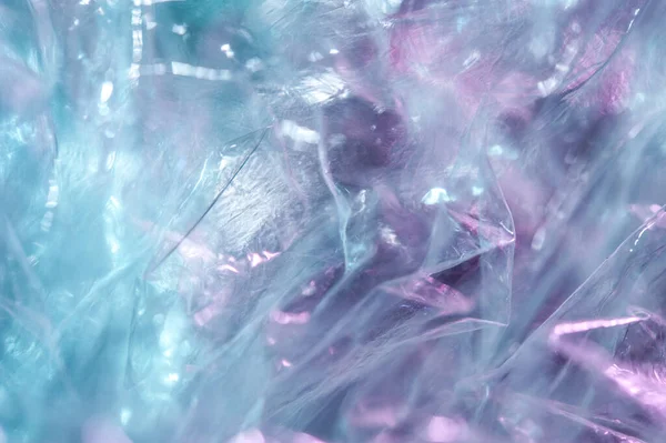 Fond holographique dans le style des années 80-90. Texture réelle du film de cellophane dans des couleurs acides vives. — Photo