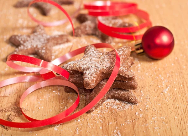 Christmas sweets and red ribbon — Stock Photo, Image