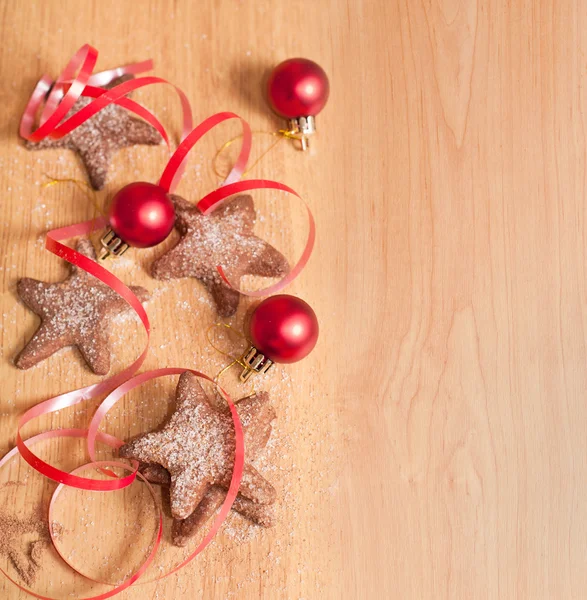 Ahşap arka plan üzerinde Noel tatlılar — Stok fotoğraf