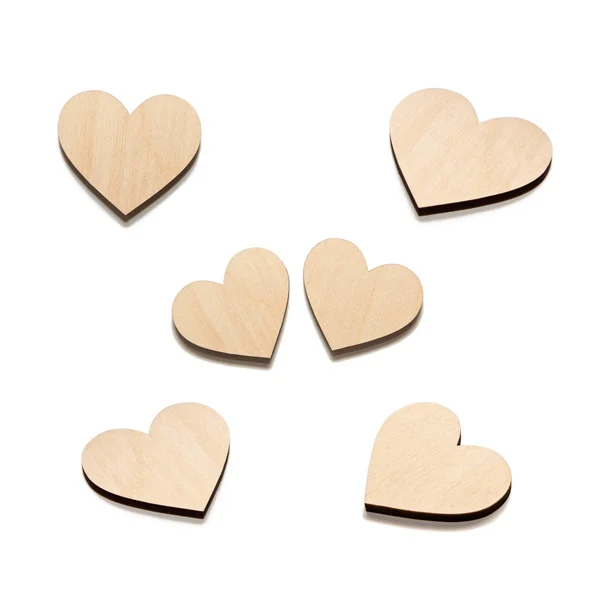 Six Wooden hearts on white — Stock Photo, Image