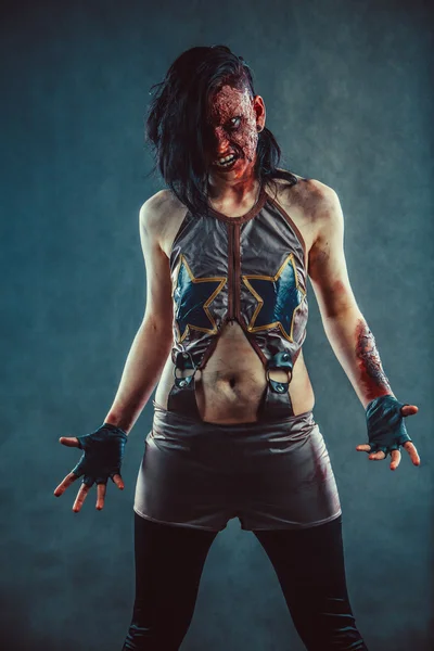 Furious zombie woman with the blood on the face and hands. — Stock Photo, Image