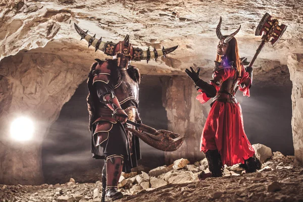 Battle of powerful knights in heavy armor in the Forbidden Caves — Stock Photo, Image