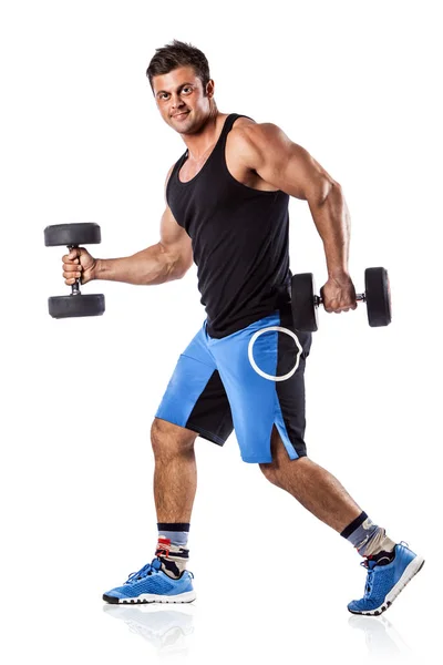 Sexy athletic man showing muscular body with dumbbells, full length, isolated over white background. — Stock Photo, Image