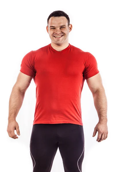 Sexy athletischer Mann zeigt muskulösen Körper, isoliert über weißem Hintergrund. — Stockfoto